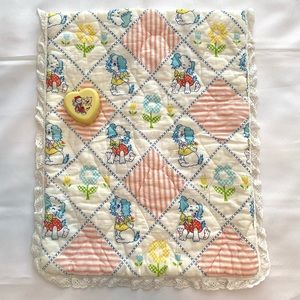 Vintage 1970s baby crib pad and music box.